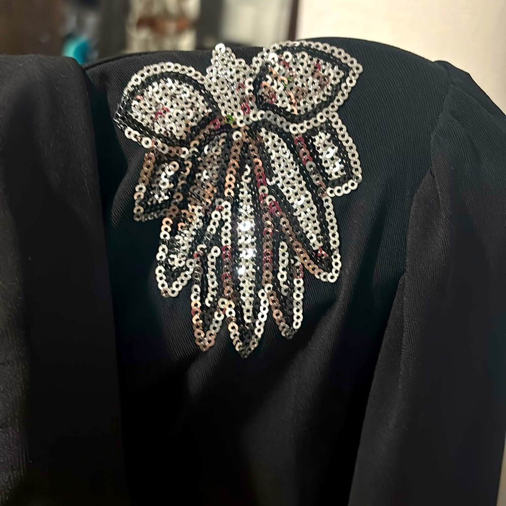 Women’s button up blouse with silver sequin embellished shoulders